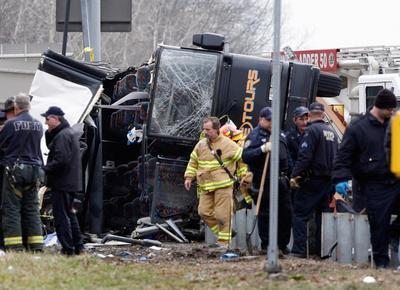 (AP Photo/David Karp, File)In this March 12, 2011 file photo, emergency personnel investigate the scene of a bus crash on Interstate-95 in the Bronx borough of New York. Twenty-six bus operations that transported more than 1,800 passengers a day along Interstate 95 between New York and Florida have been closed for safety violations in what federal officials say is the government's largest single safety crackdown of the motor coach industry in at least a decade.