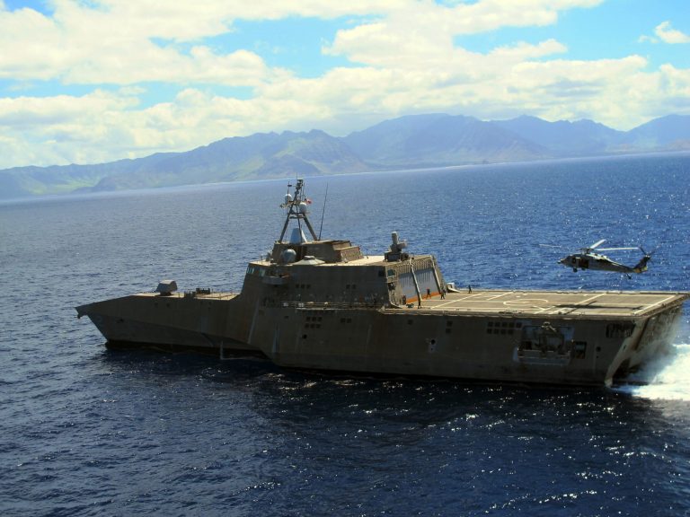 A Navy helicopter lands on the USS Independence in waters off Honolulu on Thursday, July 24, 2014. (AP Photo)