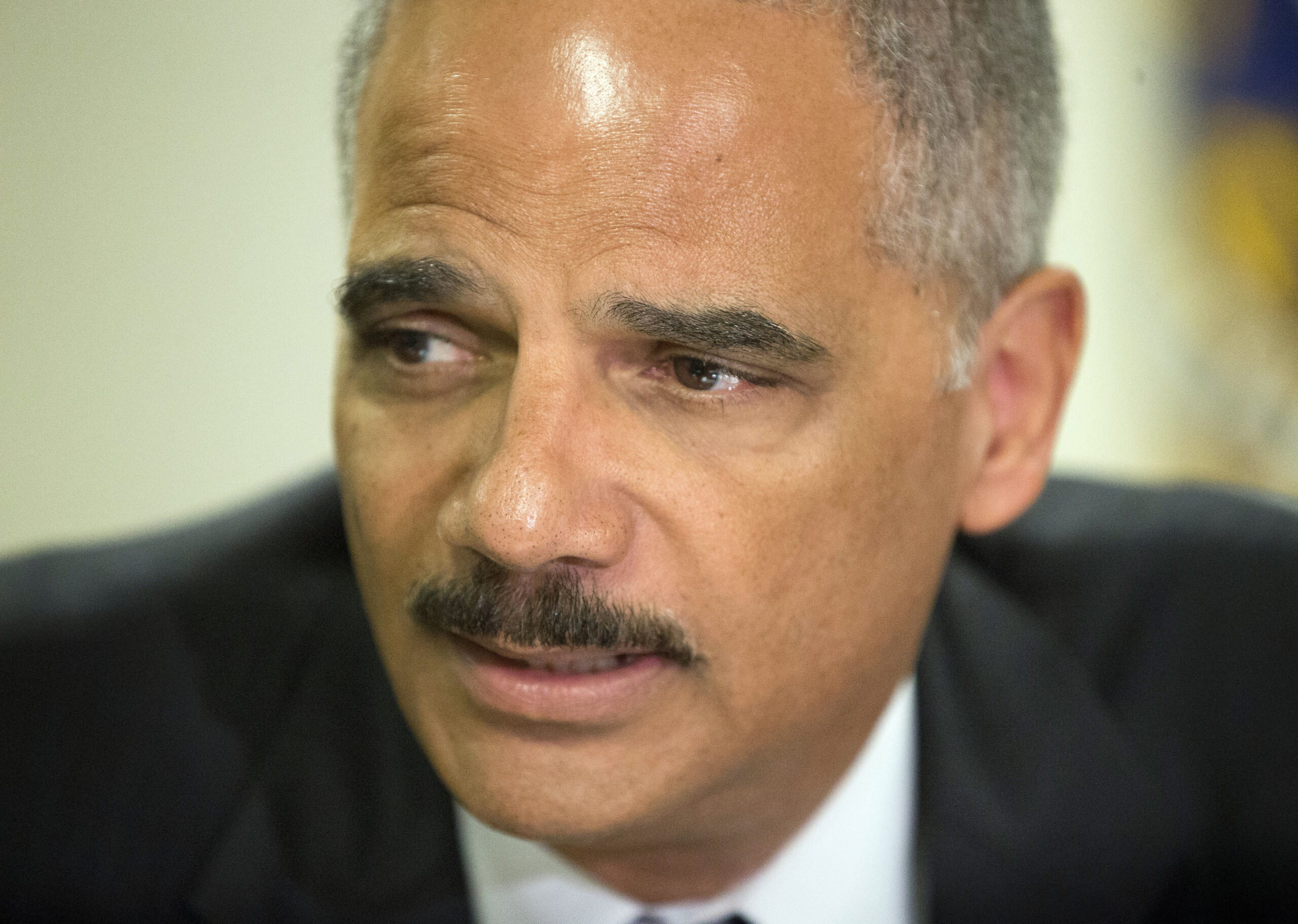 Holder discusses police mistrust outside Ferguson