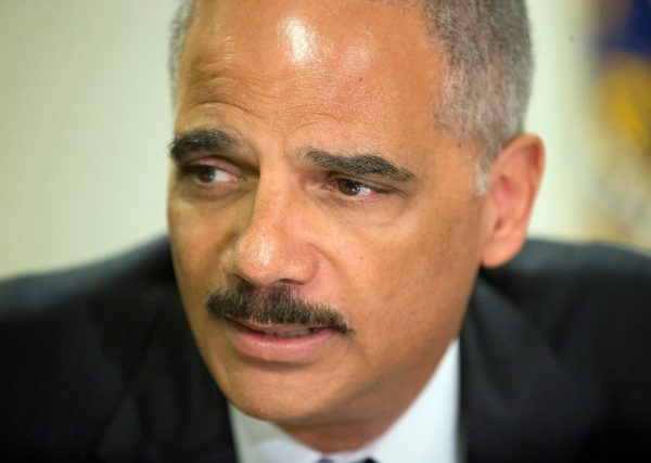 Holder discusses police mistrust outside Ferguson