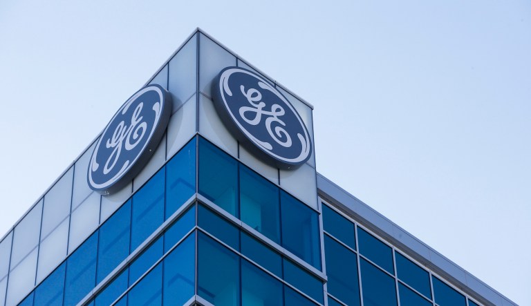 General Electric is cooperating with a Justice Department probe of a discontinued mortgage business.