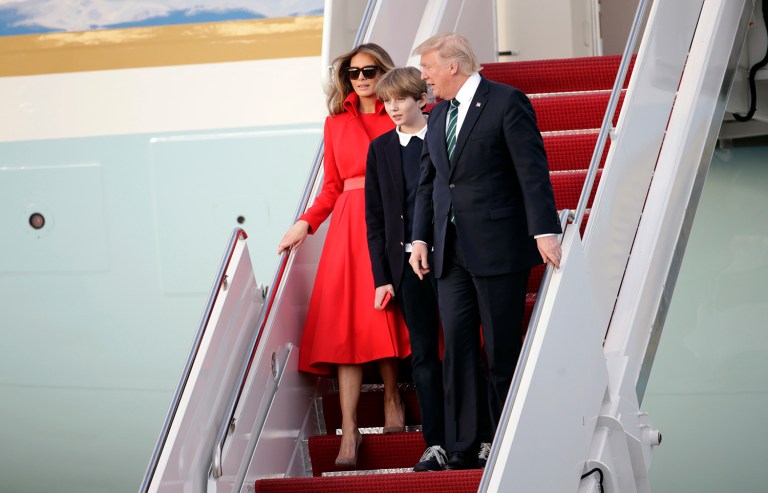 President Trump walks from Air Force One with first lady Melania and son Barron after arriving at the Palm Beach International Airport in West Palm Beach, Fla. Trump is on track to rack up more travel costs in his first year as president than President Obama had during his eight years in office (AP Photo/Lynne Sladky)