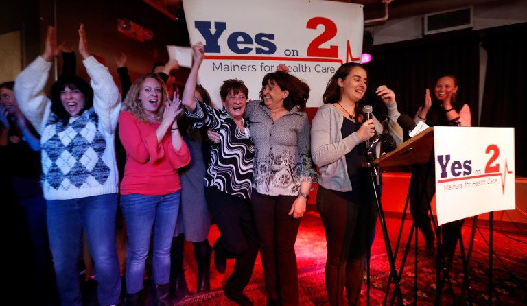 Supporters of Medicaid expansion celebrate their victory, Tuesday, Nov. 7, 2017, in Portland, Maine. Maine voters say they want to join 31 other states in expanding Medicaid under the Affordable Care Act, the signature health bill of former President Barack Obama. (AP Photo/Robert F. Bukaty)