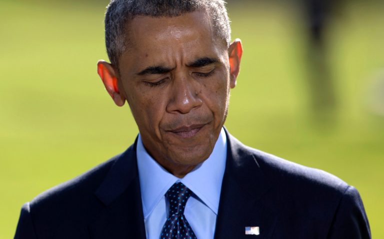 President Obama pauses as he speaks about the participation of five Arab nations in airstrikes against militants in Syria, on the South Lawn the White House. (AP Photo/Carolyn Kaster)