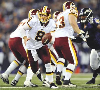 Gail Burton/AP
Rex Grossman has spent more time facing starting defenses than his competition to start at quarterback, John Beck.