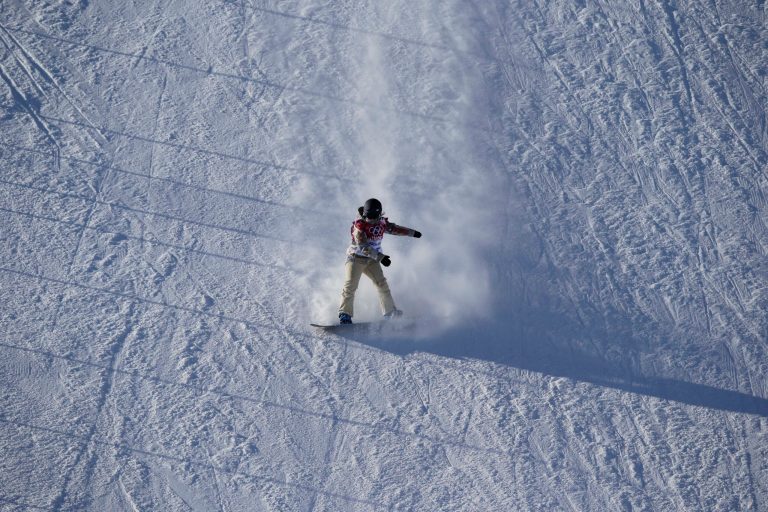 United States' Ty Walker competes during the women's snowboard slopestyle qualifying at the Rosa Khutor Extreme Park ahead of the 2014 Winter Olympics, Thursday, Feb. 6, 2014, in Krasnaya Polyana, Russia.  (AP Photo/Andy Wong)