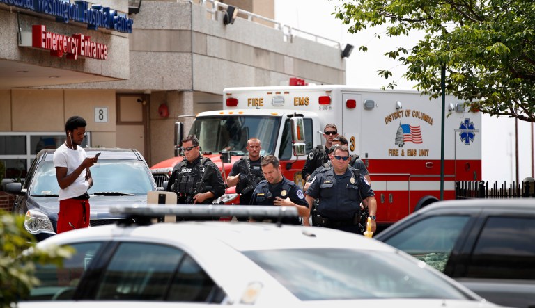 Capitol Police leave the emergency entrance at MedStar Washington Hospital Center in Washington, Wednesday, June 14, 2017, where House Majority Whip Steve Scalise was taken after being shot in Alexandria, Va., during a congressional baseball practice. (AP Photo/Jacquelyn Martin)