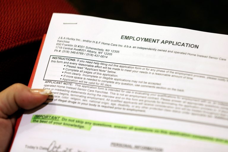 FILE - In this Thursday, Oct. 25, 2012, file photo, Carmen Nazario of Albany, N.Y., fills out an employment application during a job fair at the Marriott Hotel in Colonie, N.Y. The Labor Department reports on the number of people who applied for unemployment benefits last week on Thursday, Aug. 14, 2014. (AP Photo/Mike Groll, File)