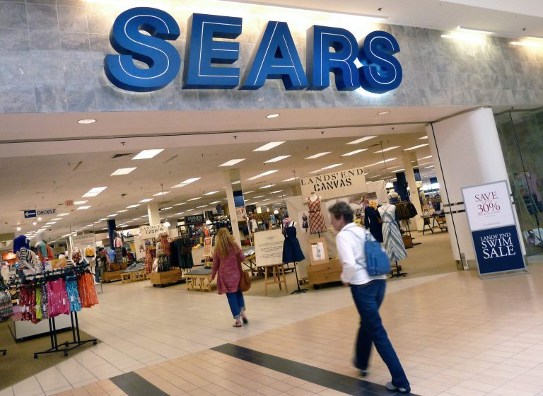 FILE - In this Monday, May 14, 2012, file photo, shoppers walk into Sears in Peabody, Mass. Sears reports quarterly earnings on Thursday, May 22, 2014. (AP Photo/Elise Amendola, File)