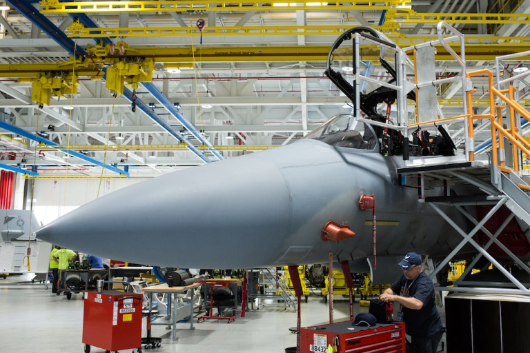 A worker performs quality checks on a Boeing Co. F/A-18 Super Hornet fighter aircraft at the Boeing Defense, Space & Security facility in St. Louis, Missouri, U.S., on Monday, July 24, 2018. Capping off a contentious contracting tussle with President Donald Trump, Boeing Co. received a $3.9 billion contract to continue development, modification and testing of two new aircraft to serve as Air Force One, according to two people familiar with the decision. 