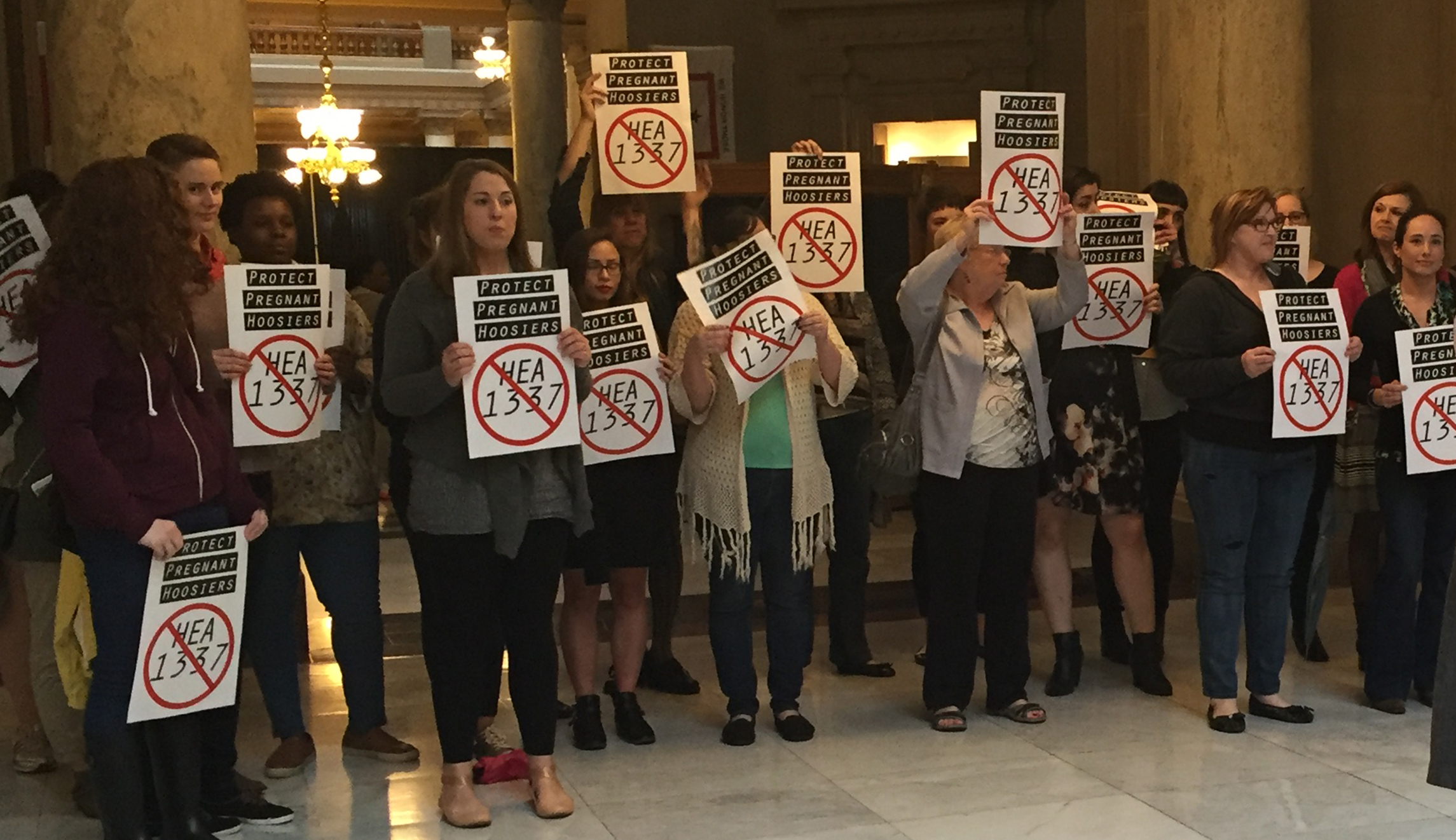 Federal judge blocks Indiana abortion law signed by Pence