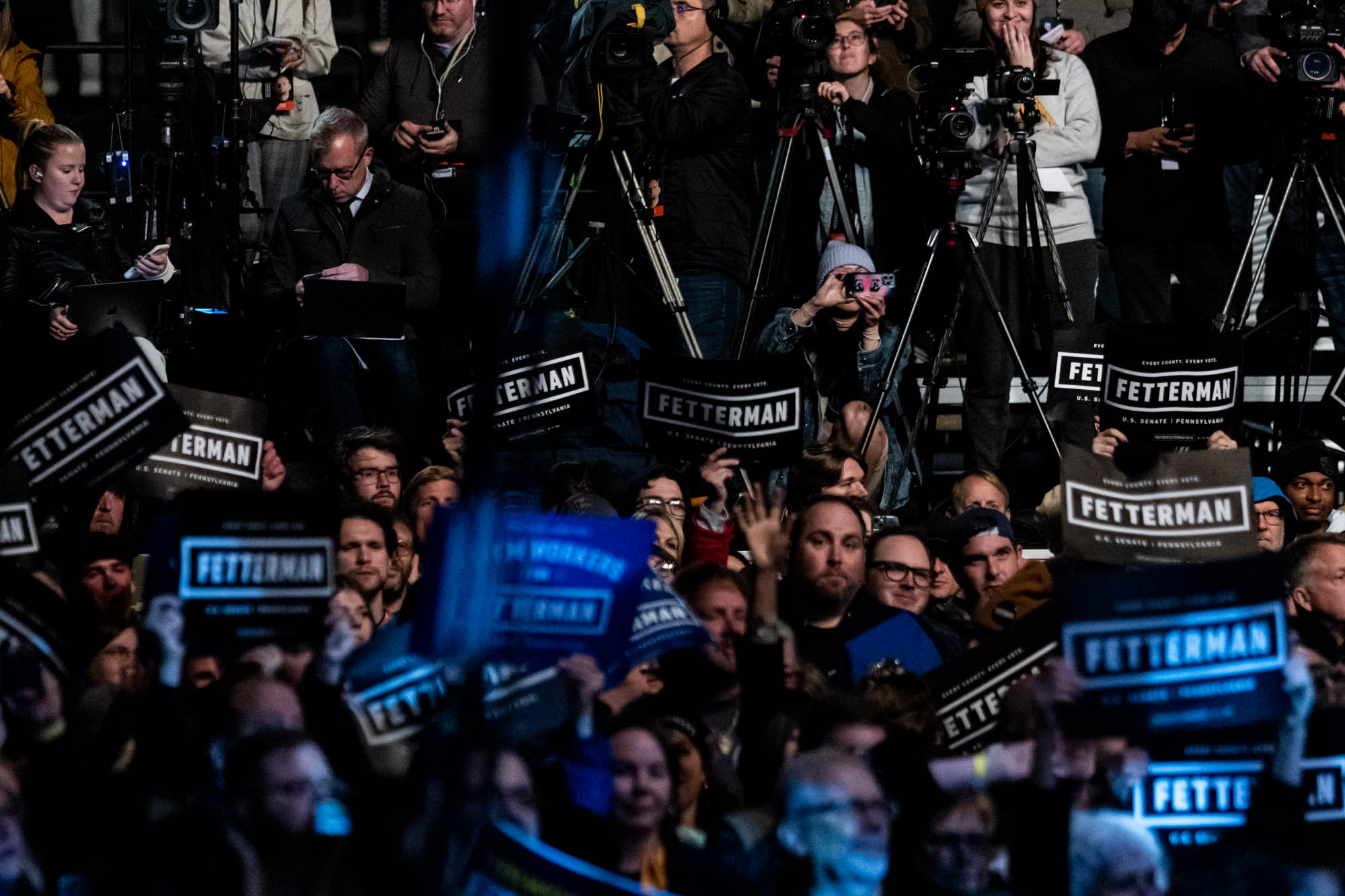 Members of the media and supporters of Democratic candidate for U.S. Senate, John Fetterman, cheer during a campaign event featuring a performance by Dave Matthews in Pittsburgh, Pennsylvania Wednesday, Oct. 26, 2022.