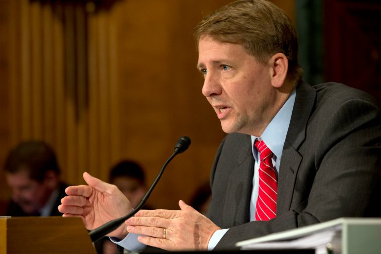 Consumer Financial Protection Bureau (CFPB) Director Richard Cordray testifies on Capitol Hill in Washington, Tuesday Nov. 12, 2013 before a Senate Banking Committee on Banking hearing on âThe Consumer Financial Protection Bureauâs Semi-Annual Report to Congress.â (AP Photo/Jacquelyn Martin)