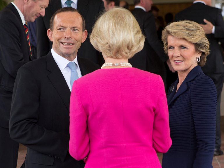 FILE - In this Sept. 18, 2013 file photo, Tony Abbott, left, talks with Foreign Minister Julie Bishop, right, after being sworn in as the 28th prime minister of Australia at Government House in Canberra. Abbott and Bishop on Thursday, July 31, 2014 sent mixed messages on whether Russia was frustrating Dutch and Australian police efforts to retrieve the bodies of victims of the Malaysian airliner disaster in war-torn east Ukraine. Bishop said she feared Russia was behind the daily artillery barrages blocking police, while Abbott said it was too early to judge. Abbott has declined to follow the U.S. and European examples by ratcheting up sanctions against Russia in a bid to pressure President Vladimir Putin into ending his country's support for the separatists. (AP Photo/Penny Bradfield, File)