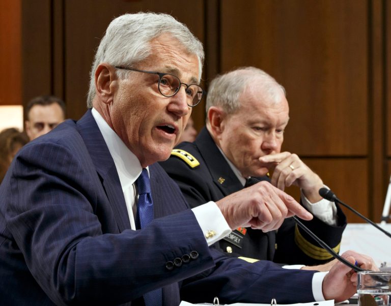 In this Sept. 16, 2014, photo, Defense Secretary Chuck Hagel, left, and Army Gen. Martin Dempsey, chairman of the Joint Chiefs of Staff, appear before the Senate Armed Services Committee in Washington. The White House and the Pentagon are grappling with how to explain what American military forces are doing and could do in Iraq as they battle the Islamic State militants. Speaking at U.S. Central Command on Wednesday, President Barack Obama reiterated his pledge to keep American troops out of combat missions. But hours later, Vice President Joe Biden appeared to be less certain about ground troops. 