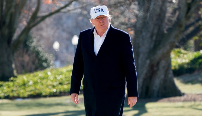 President Trump was scheduled to leave for Davos on Wednesday. When reporters asked the White House press secretary whether Trump's trip will still take place if the government shutdown continues this week, she said, "I don't know that that's very likely. I wouldn't imagine that it is." (AP Photo/Andrew Harnik)