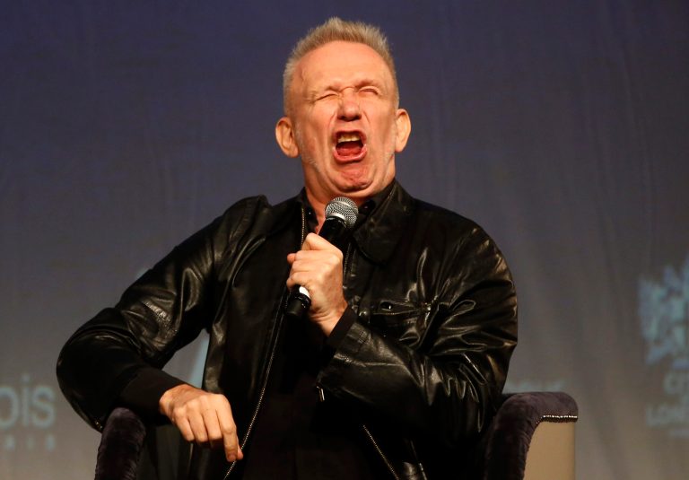 French couturier Jean Paul Gaultier pulls a face as he speaks to the media during  a Q&A session during the launch his exhibition 'The Fashion World of Jean Paul Gaultier : From the Sidewalk to the Catwalk' at the Barbican Art Gallery in London, Tuesday, April 8, 2014. (AP Photo/Sang Tan)