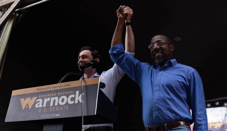 Sen. Jon Ossoff speaks at a campaign rally for Sen Raphael Warnock in Macon, Georgia, Monday, November, 7, 2022