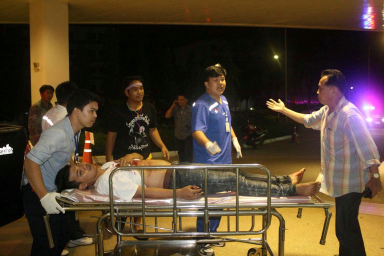 In this Saturday, Feb. 22, 2014 photo, a protester injured in an anti-government rally arrives for treatment at a hospital in Trat Province, 300 kilometers (180 miles) east of Bangkok, Thailand. At least 35 people were hurt Saturday night when the rally was attacked by gunmen, police said. Police Lt. Thanabhum Newanit said attackers shot into the crowd and two explosive devices went off. (AP Photo/Daily News) THAILAND OUT