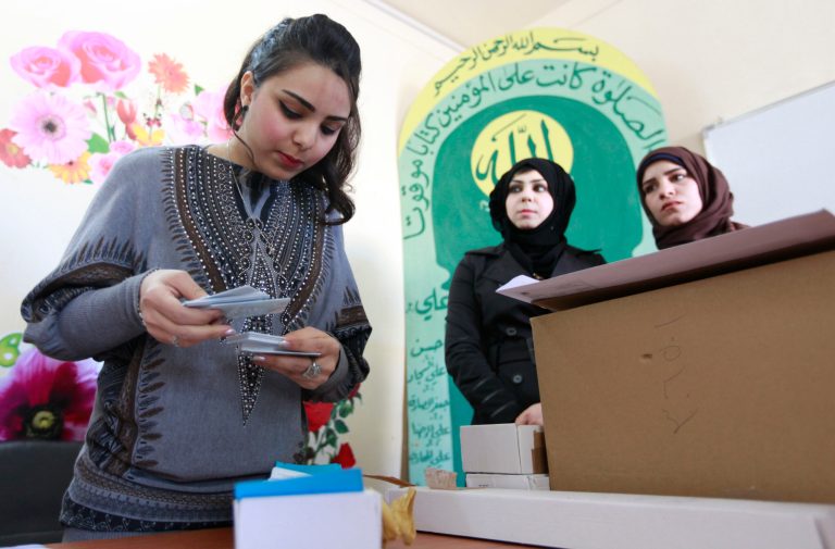 As Iraq hands out election IDs, unrest rages on