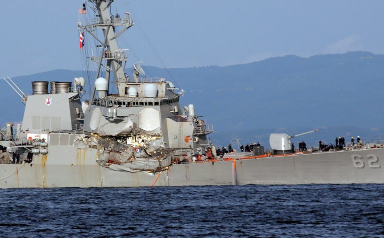 The U.S. Navy destroyer USS Fitzgerald returned to Yokosuka, Japan about 16 hours after it collided with a merchant vessel. (AP Photo/Eugene Hoshiko)