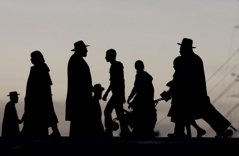 FILE - In this Thursday, Feb. 11, 2010 file photo, ultra-Orthodox Jews walk in Jerusalem on Wednesday, May 1, 2013. A new book spelling out the how-to's of sexual intercourse aims to get Israel's Orthodox Jews talking about sex, targeting an audience typically mum on the steamy subject. (AP Photo/Bernat Armangue, File)