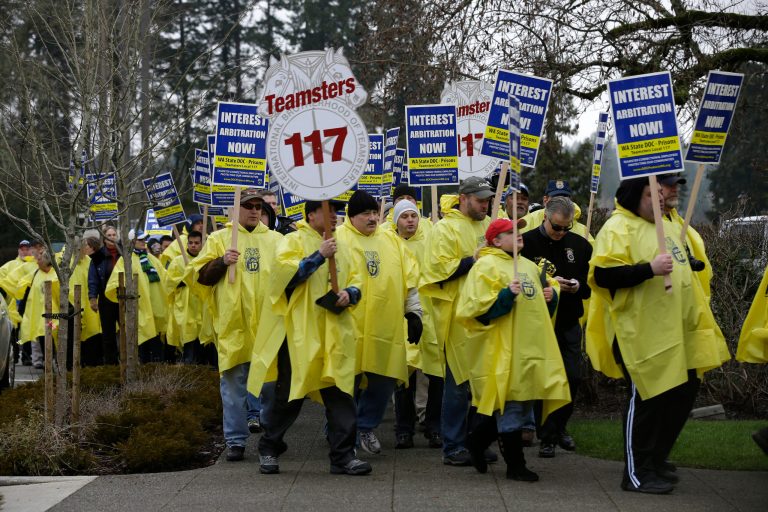 Washington state corrections workers and members of Teamsters Local Union 117 marchÃÂ at the Capitol in Olympia, Wash., on Jan. 10.ÃÂ (AP Photo/Ted S. Warren)