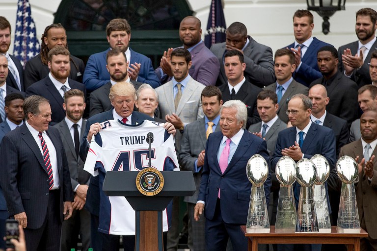 President Donald Trump is presented with a New England Patriots jersey during a ceremony on the South Lawn of the White House in Washington, Wednesday, April 19, 2017. (AP Photo/Andrew Harnik)