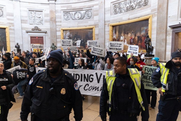 Protesters demonstrate for a ceasefire in the Israel-Hamas war in the rotunda of the United States Capitol in Washington, D.C., on Tuesday, Dec. 19, 2023.