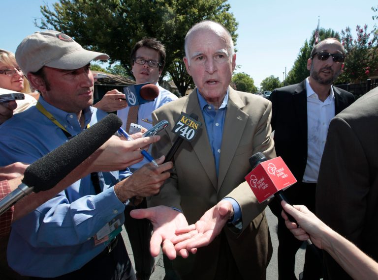 Gov. Jerry Brown talks to reporters about his campaign for a November ballot initiative that would temporarily increase sales and income taxes to stave off state budget cuts that could include three fewer weeks of school, during a visit to New Technology High School in Sacramento, Calif., Wednesday, Aug. 15, 2012.  If approved by voters, Prop. 30 would raise the state sales tax by a quarter cent for four years and raise taxes on incomes over $250,.000 for seven years. (AP Photo/Rich Pedroncelli)