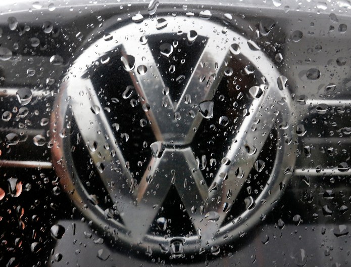 The company said the round of job cuts equals about 5 percent of its global workforce, and is part of a long-term effort to improve profits while transitioning to building more electric cars. (AP Photo)