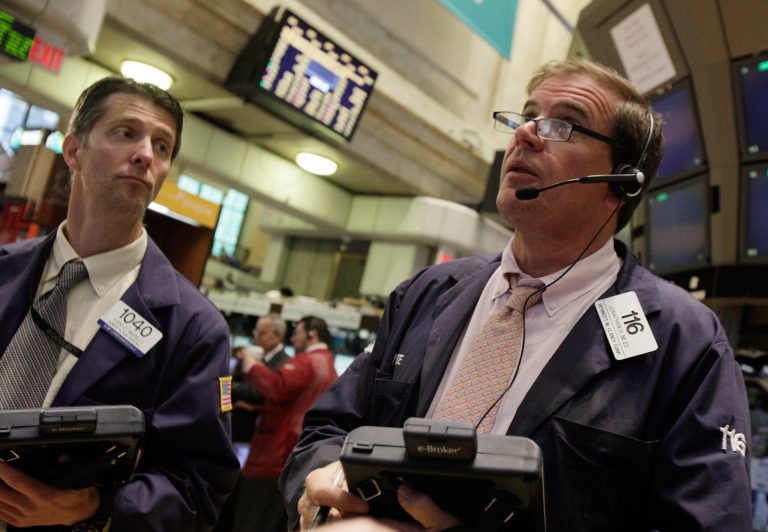   Traders Todd Ingrilli, left, and Jonathan Niles work on the floor of the New York Stock Exchange Monday, June 18, 2012. U.S. stocks are falling after the opening bell as Europe's debt crisis roils markets despite the victory of a pro-Europe party in Greek elections. (AP Photo/Richard Drew)  