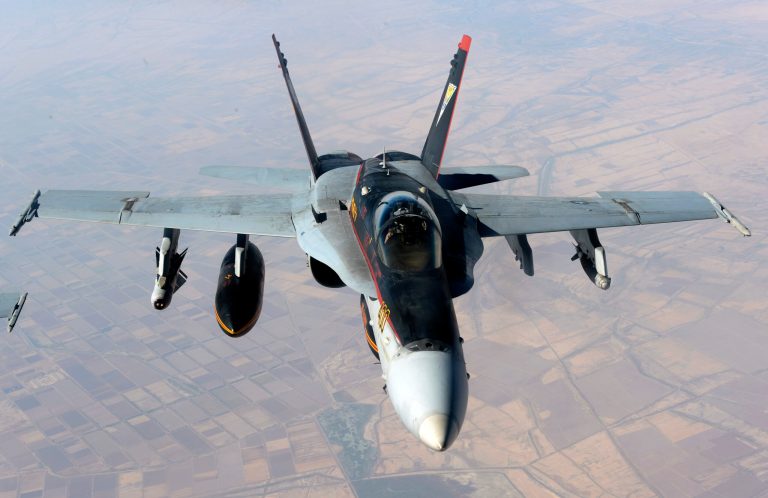 A U.S. Navy F-18E Super Hornet supporting operations against the militant Islamic State group, leaves after receiving fuel from a KC-135 Stratotanker over Iraq. (AP Photo/U.S. Air Force, Shawn Nickel, File)