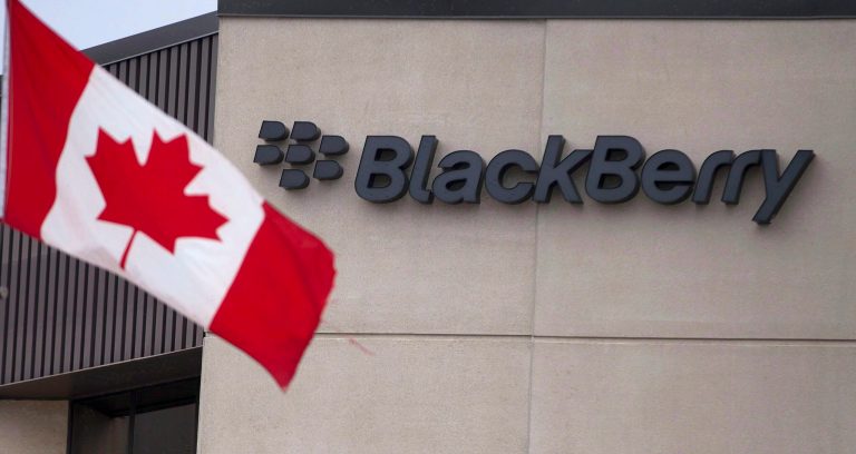 In this July 9, 2013 photo, a Canadian flag flies at BlackBerry's headquarters in Waterloo, Ontario. BlackBerry posted a loss of $207 million in the second quarter on Friday, Sept. 26, 2014, just days after the embattled company launched a new phone. (AP Photo/The Canadian Press, Geoff Robins)