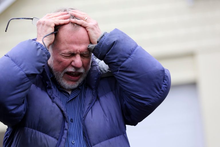   Gene Rosen becomes emotional as he describes, in an interview with The Associated Press, Monday, Dec. 17, 2012, that after Friday's shooting at Sandy Hook Elementary School, he took in six students who were sitting at the end of his driveway who had just run from the school to escape the deadly massacre. Rosen ran upstairs and grabbed an armful of stuffed animals he kept there. He gave those to the children, along with some fruit juice and sat with them as two of the students described seeing their teacher being shot. (AP Photo/Mary Altaffer)  