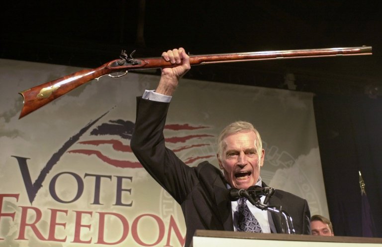 Former National Rifle Association president Charlton Heston addresses gun owners during a 