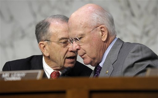 In this Feb. 13, 2013 file photo Senate Judiciary Committee Chairman Sen. Patrick Leahy, D-Vt., right, talks with the committee's ranking Republican Sen. Charles Grassley, R-Iowa on Capitol Hill in Washington.