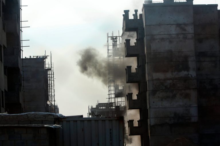 Smoke rises from a building which Taliban fighters used for cover during clashes with government troops, in Kabul, Afghanistan, on July 17. (AP Photo/Massoud Hossaini)