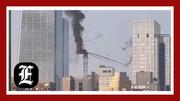 New York City crane collapse: Construction equipment tumbles to ground as it is engulfed in flames