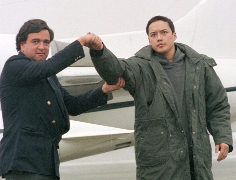 FILE - In this Nov. 27, 1996 file photo, U.S. Rep. Bill Richardson, D-N.M., left, shakes hands with Evan C. Hunziker of Tacoma, Washington, upon their arrival at Yokota Air Base on the outskirts of Tokyo.  Hunziker, 26, who was jailed for three months in North Korea on spy charges was freed and arrived in Japan with Richardson who negotiated his release. Time and again, Americans over the years have slipped into poor, deeply suspicious, fervently anti-American North Korea, crossing a border that tens of thousands of desperate North Koreans have crossed in the opposite direction, at great risk. Whatever their reasons, Americans detained in North Korea, including the three currently there, are major complications for Washington, which must decide between letting a U.S. citizen languish and providing Pyongyang with a huge propaganda victory by sending a senior U.S. envoy to negotiate a release. (AP Photo/Katsumi Kasahara)