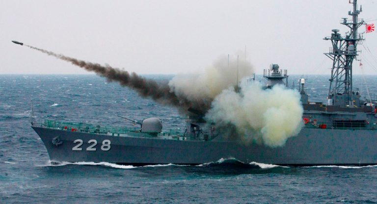 A Japanese Maritime Self Defense Force destroyer fires an anti-submarine rocket during a fleet review off Sagami, south of Tokyo, Japan, Sunday, Oct. 25, 2009.(AP Photo/Itsuo Inouye)