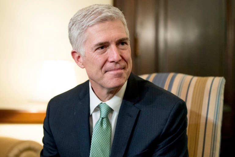 Ads tell viewers to urge their senators to support Supreme Court nominee Neil Gorsuch. (AP Photo/Andrew Harnik)