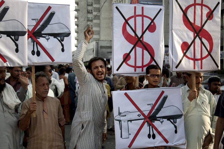 Supporters of Pakistan's Islamist party rally against U.S. drone strikes on hideouts of militants in the country's tribal areas. (AP Photo/Shakil Adil)