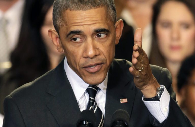 President Obama addresses the crowd on issues surrounding the protests in Ferguson, Mo., Tuesday in Chicago. (AP Photo/Charles Rex Arbogast)