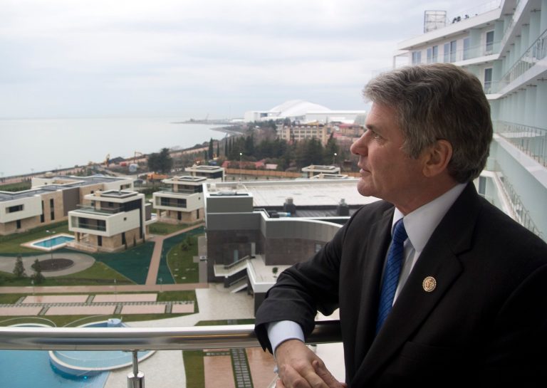 Rep. Michael McCaul, chairman of the House Homeland Security Committee, stands on the balcony of his hotel overlooking the Olympic Park in the Black Sea resort of Sochi, Russia, on Tuesday. (AP Photo/Nataliya Vasilyeva)