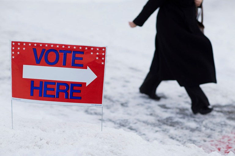 A voter walks in to a polling site to to cast a ballot in the New Hampshire primary Tuesday, Feb. 9, 2016, in Nashua, N.H. (AP Photo/David Goldman)