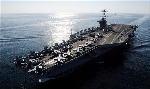 In this Nov. 12, 2011photo provided by the U.S. Navy, the Nimitz-class aircraft carrier USS John C. Stennis (CVN 74) transits the Straits of Hormuz.