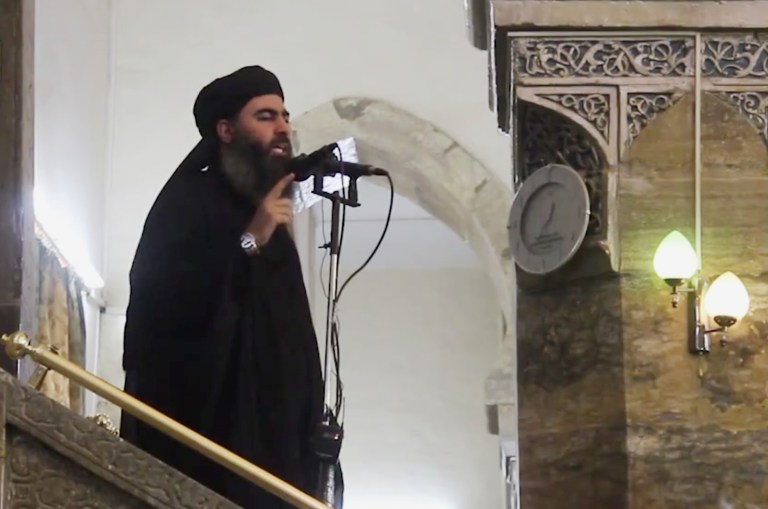 This image made from video posted on a militant website Saturday, July 5, 2014, which has been authenticated based on its contents and other AP reporting, purports to show the leader of the Islamic State group, Abu Bakr al-Baghdadi, delivering a sermon at a mosque in Iraq. (AP Photo/Militant video)