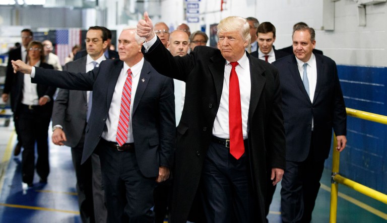 Then President-elect Trump and Vice President-elect Mike Pence visited the Carrier factory in Indianapolis. Before taking office, Trump made a deal with the Carrier Corporation. Pence would arrange $7 million in bespoke tax breaks and the company would keep 1,000 jobs in Indiana for a decade. (AP Photo/Evan Vucci, File)