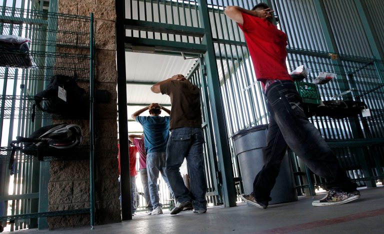 Illegal immigrants prepare enter a bus after being processed at Tucson Sector U.S. Border Patrol Headquarters Thursday, Aug. 9, 2012, in Tucson, Ariz. (AP Photo/Ross D. Franklin)